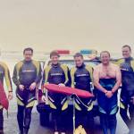 Members of the Ocean Shores surf rescue team, including Jim Davis, second from left, pose for a photo. Photo: The Davis Family