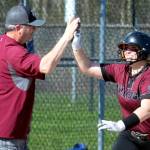 RYAN SPARKS | THE DAILY WORLD Montesanos Alisyn Parkin gets a high-five from head coach Pat Pace after hitting a home run during the Bulldogs 12-6 victory over Elma on Thursday in Elma.