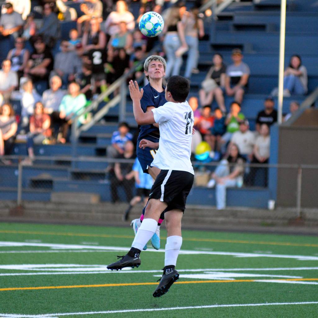 RYAN SPARKS | THE DAILY WORLD Aberdeens Colby Mendoza, backround, heads the ball over Sheltons Kaedence Salazar during the Bobcats 6-0 win on Friday in Aberdeen.