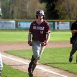 RYAN SPARKS | THE DAILY WORLD Montesanos Kaleb Ames cheers after scoring a run during the first inning of the Bulldogs league-clinching 8-6 victory over Tenino on Tuesday at Vessey Field in Montesano.