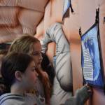 Clayton Franke / The Daily World
Elena Sotomish, front, and Hanna Rice read an informational sign on the inside of an inflatable brain.