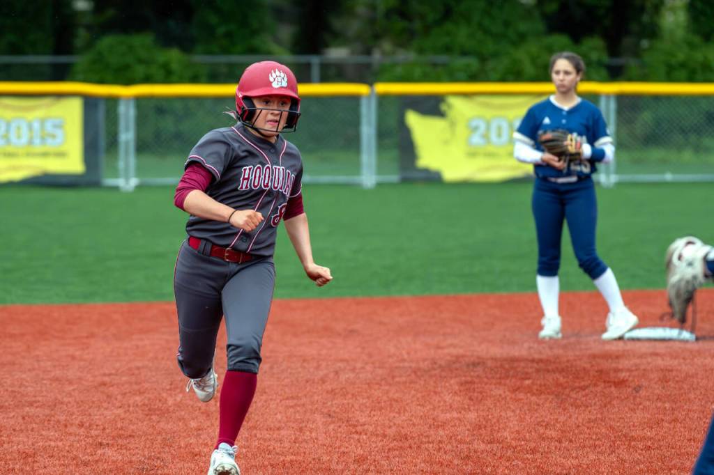 PHOTO BY FOREST WORGUM Hoquiams Graci Bonney-Spradlin, left, approaches third base during a 16-5 win over Cedar Park Christian on Friday in Montesano.