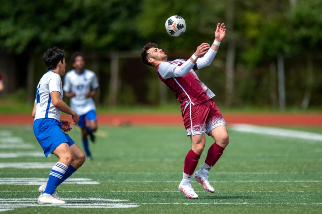 PHOTO BY FOREST WORGUM Montesanos Mateo Sanchez, right, plays the ball during the Bulldogs 7-2 victory in the 1A District 4 Tournament on Saturday in Montesano.