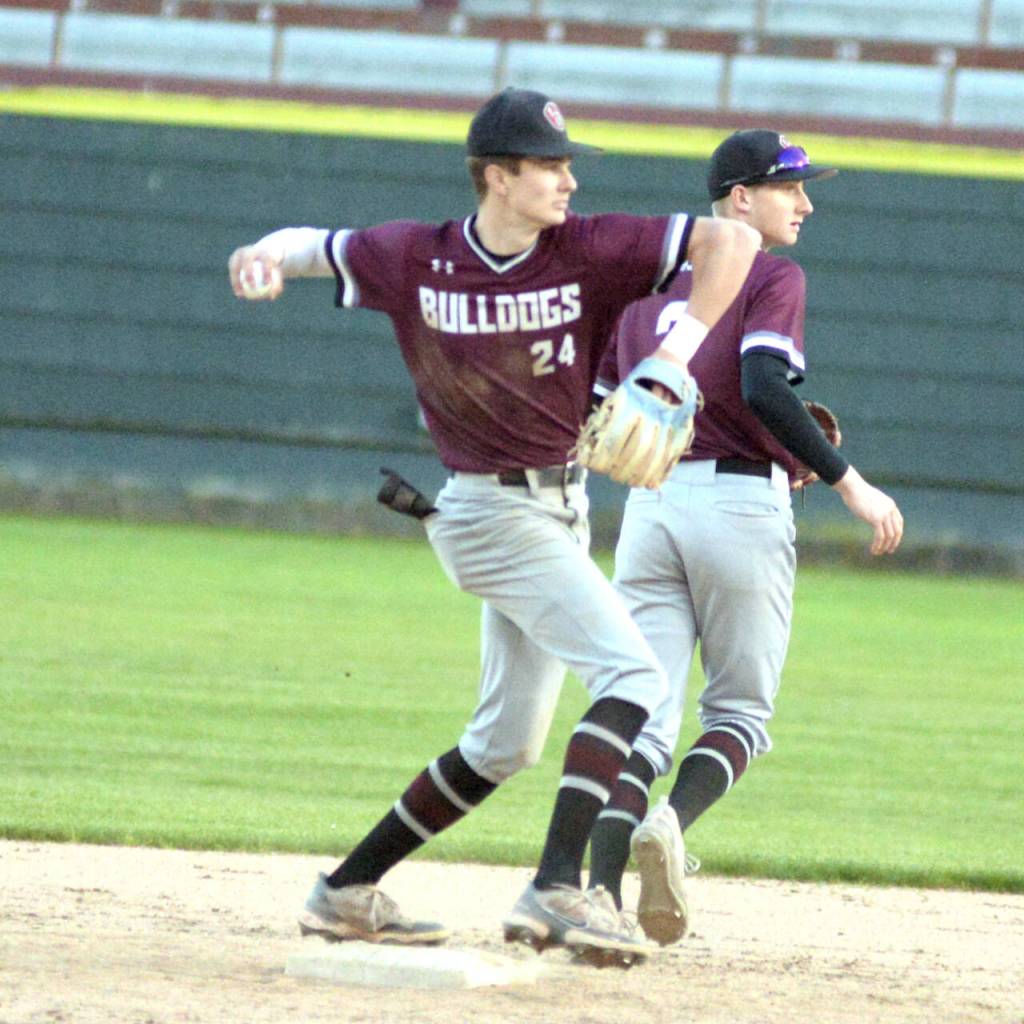 RYAN SPARKS / THE DAILY WORLD
Montesano shortstop Bode Poler (24) turns a double play during the Bulldogs 4-2 victory over Elma in a 1A District 4 semifinal game.
