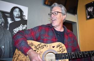 Photos by Matthew N. Wells / The Daily World
Local musician Wil Russoul, whos also executive director of the Downtown Aberdeen Association, strums his almost completed song, Love, Love, Love on an acoustic guitar at Nirvana Coffee Company  205 S. I St., in Aberdeen. Russoul, who always seems to be in the mood to play music, played a short setlist to Amy Mathews-Smith, Nirvana Coffees owner, and her customers.