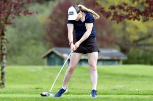 ALEC DIETZ | THE CHRONICLE Aberdeens Britt Rajcich tees off at the 2A Evergreen Conference Championships on Tuesday at Tumwater Valley Golf Course in Tumwater. Rajcich would go on to place first and lead Aberdeen to the league championship.