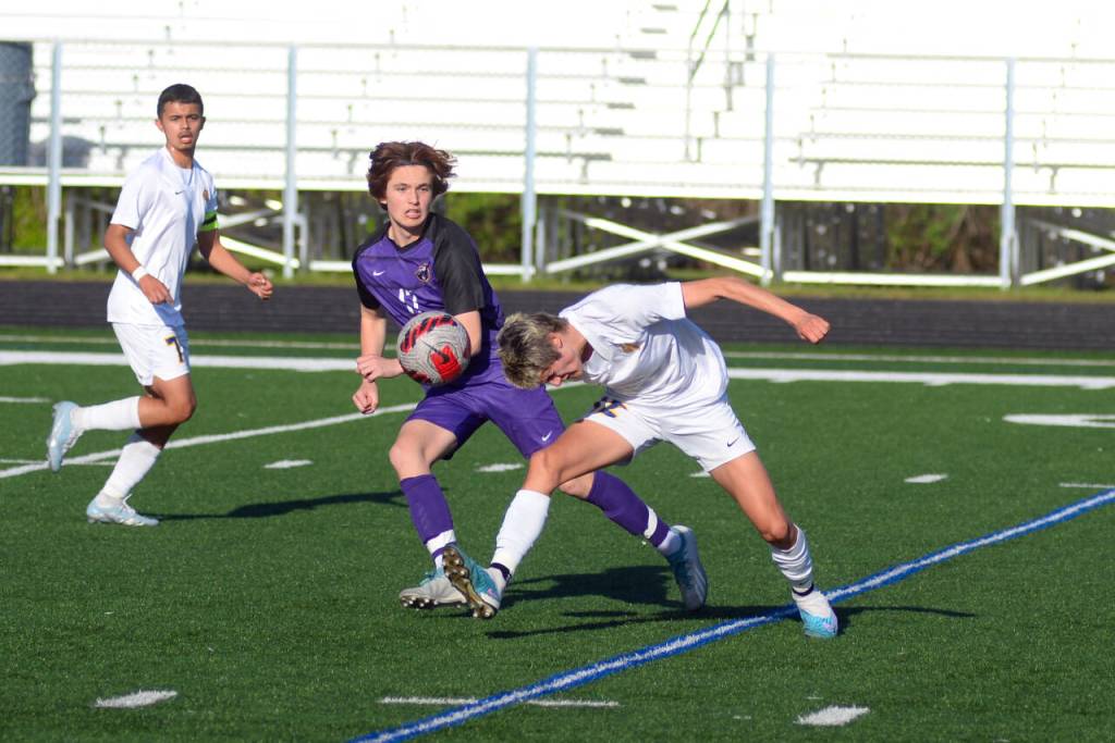 RYAN SPARKS | THE DAILY WORLD Aberdeens Colby Mendoza, right, heads the ball against Columbia Rivers Ryland Perron during the Bobcats 3-0 loss in the 2A District 4 championship game on Thursday at Columbia River High School in Vancouver.