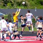 RYAN SPARKS | THE DAILY WORLD Montesano junior midfielder Levi Clements (21) attempts a header during the Bulldogs victory over Seton Catholic in the 1A District 4 title game on Saturday in Tenino.