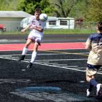 RYAN SPARKS | THE DAILY WORLD Montesano senior defender Michael Neal heads the ball forward during a 2-1 victory over Seton Catholic in the 1A District 4 Championship game on Saturday at Tenino High School.