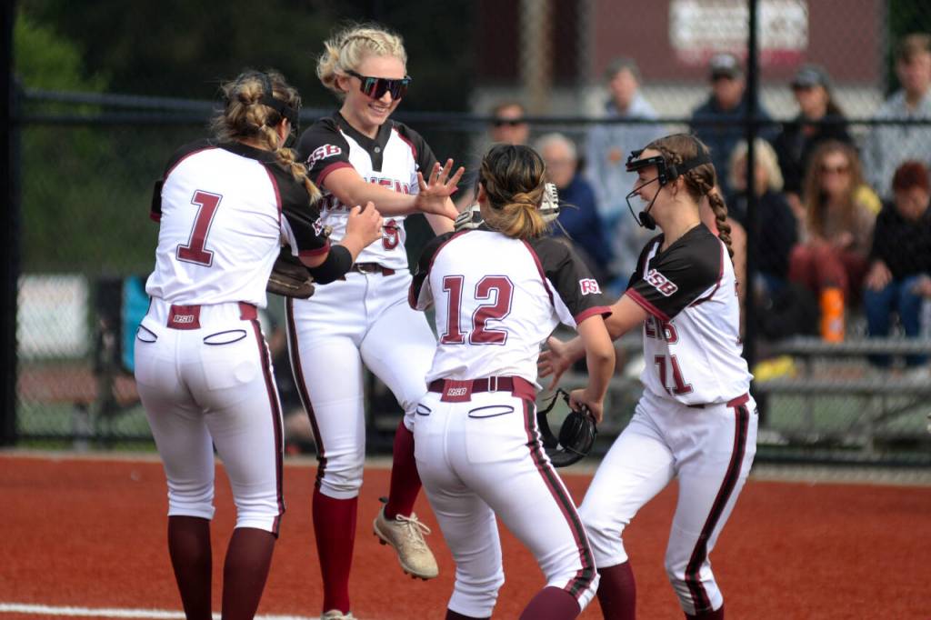 RYAN SPARKS | THE DAILY WORLD Raymond-South Bend players (from left) Kyndal Koski, Cadence Swogger, Raydynn Morley and Ashlee Payne celebrate a defensive play during a 12-9 win over Napavine in the 2B District 4 Tournament on Monday in Montesano.