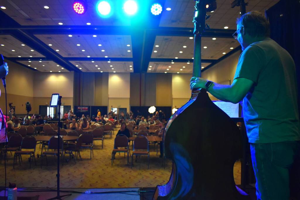 Matthew N. Wells / The Daily World
The view from behind Steve Leggett  on stand-up bass  allows for a view of the growing crowd at Celebrate Summer Jam. Leggett played bass on Saturday for The Akoostiks at the music festival that helped kick off an early preview of summer.