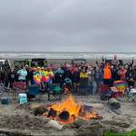 Courtesy photo / Nicole Koch
Participants in last years Clean Shores event pose with the traditional bonfire.