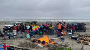 Courtesy photo / Nicole Koch
Participants in last years Clean Shores event pose with the traditional bonfire.