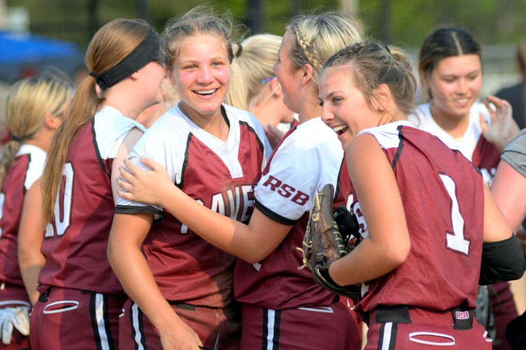 RYAN SPARKS / THE DAILY WORLD Raymond-South Bend infielders Kassie Koski, second from left, and Kyndal Koski (1) celebrate with their teammates after beating Rainier 7-2 to advance in the 2B District 4 Tournament on Wednesday in Centralia.