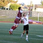 RYAN SPARKS | THE DAILY WORLD Montesano senior Mateo Sanchez, left, heads the ball against Northwest Christians Wesley Jones during the Bulldogs 1-0 victory in a 1A State Tournament game on Friday at Jack Rottle Field in Montesano.