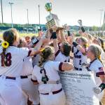 PHOTO BY SHAWN DONNELLY 
The Montesano Bulldogs raise the district-championship trophy after beating Hoquiam 8-7 in the 1A District 4 Championship game on Saturday in Centralia.
