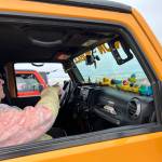 Clayton Franke / The Daily World
Marilyn Stroman sits in her Jeep, named Dozer the Minion Mobile, on the beach at Chance A La Mer on Saturday, May 20.