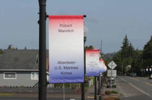 Michael S. Lockett / The Daily World
Memorial banners line the main street of Cosmopolis, the fruit of a years-long effort by a local veteran to collect the names of the war dead from the county.