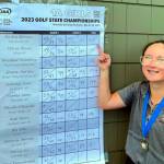 SUBMITTED PHOTO Montesano junior Hailey Blancas points to her score on the leaderboard after winning the 1A State Championship on Wednesday at the Riverside Golf Course in Chehalis.