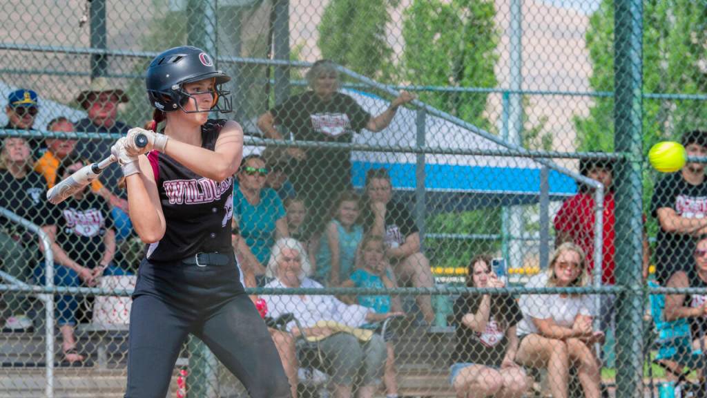 JARED WENZELBURGER | THE CHRONICLE Ocostas Gabby Ness eyes a pitch during a 4-3 win over Northwest Christian (Colbert) in a 2B State quarterfinal game on Friday at the Gateway Sports Complex in Yakima.
