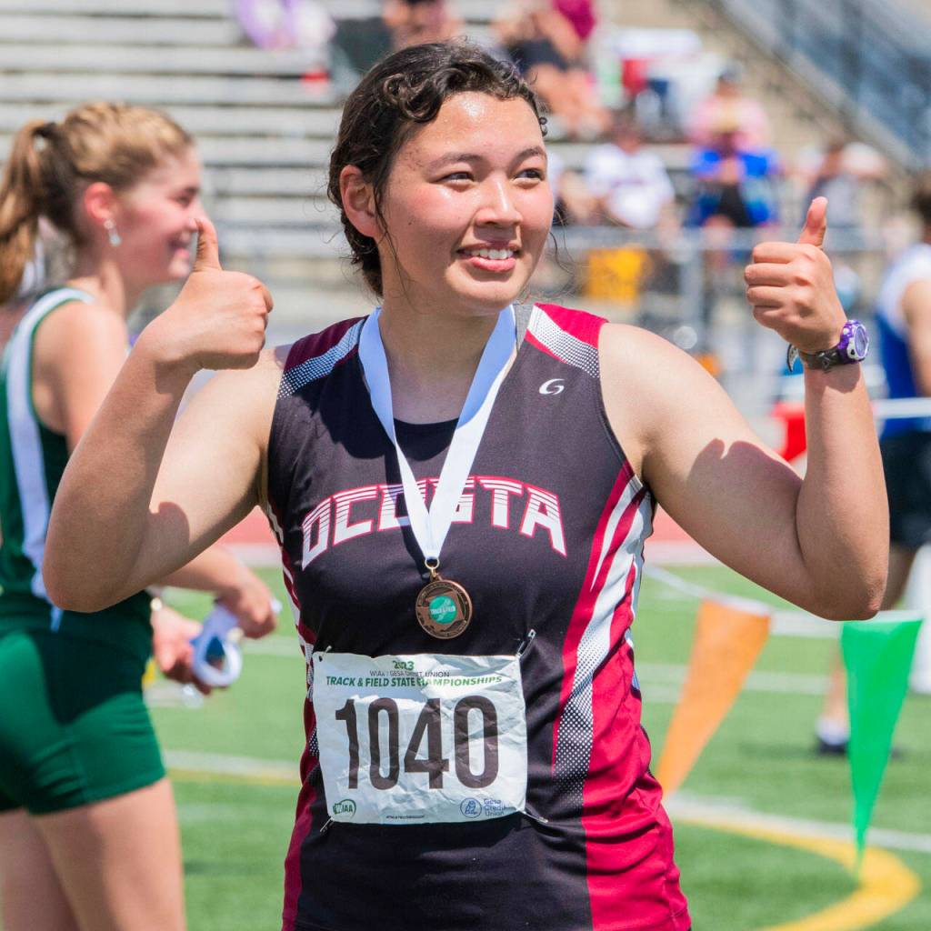 JARED WENZELBURGER | THE CHRONICLE Ocostas Rebekah Stone poses for a photo after receiving a state-medal during the 1A/2B/1B State Track & Field Championship meet in Yakima on Saturday.