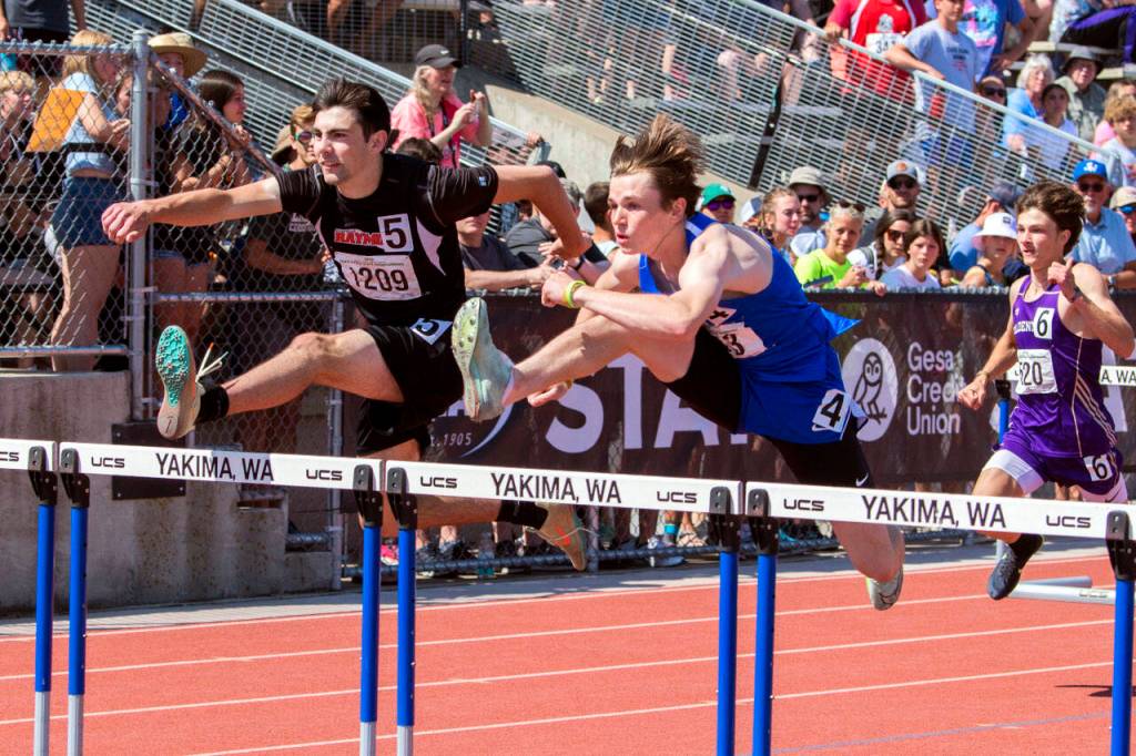 JARED WENZELBURGER | THE CHRONICLE Raymonds Morgan Anderson, left, races against La Conners Tommy Murdock in the boys 110-meter hurdles at the 2B State Championships Saturday in Yakima.