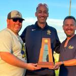 SUBMITTED PHOTO Aberdeen assistant coach Brandon Siano, head coach Jimmy McDaniel, and assistant coach Kyle Scott pose for a photo with the 2A State fourth-place trophy on Saturday in Selah.