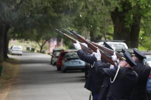 The Veterans of Foreign Wars Post 224 honor guard fires the third volley of a rifle salute during a Memorial Day Ceremony at Fern Hill Cemetery on May 29. (Michael S. Lockett / The Daily World)