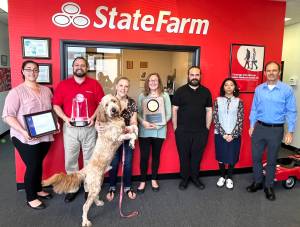 Matthew N. Wells / The Daily World
The award-winning State Farm team, from left: Makayla Solberg, David Steinman, Kimberly Pineda (with Bear, the office dog,) Donna Steinman, Brian Lavallee Sr., Karina Rivera-Rojas and Syd Sutton. The team recently won the Presidents Club Award and was named to the Chairman Circle, which are two prestigious insurance awards.