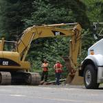 Workers repair damage after a driver was involved in a fatal single-vehicle accident early Tuesday morning on Ocean Beach Road near Hoquiam. (Michael S. Lockett / The Daily World)