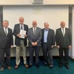 From left: Port of Grays Harbor legal counsel Art Blauvelt, commissioner Tom Quigg, commissioner Phil Papac, commissioner Stan Pinnick, and finance director Mike Folkers pose with a recently-signed resolution creating the first tax increment financing area in Grays Harbor County, which will help finance the ports Terminal 4 expansion (Courtesy photo / Port of Grays Harbor)