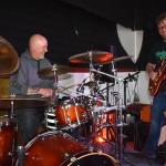 Matthew N. Wells / The Daily World
Larry Cowles, drummer for 80s cover band This Way Out, left, hammers the drums as Justin Kautzman, guitarist and singer for Black Shepherd, plays Cowles electric guitar Tuesday afternoon inside The Loading Dock, in downtown Aberdeen.