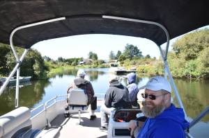 Photos by Clayton Franke / The Daily World
Jeff Owen, co-founder of Canal Brothers of Ocean Shores, which provides free canal tours to the public, captains his 16-foot pontoon on Friday, June 2, accompanied by friends Dale Vacknitz, Pete Nonan and Frank Elduen in the bow.