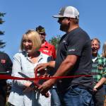 Matthew N. Wells / The Daily World
Linda Springer and Jeff Nations, Cosmopolis parks superintendent, cut the red ribbon in a ceremony that welcomed about 60 people to Highland Park. The park has gone through a slew of renovations, including countless hours from community volunteers.
