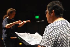 Matthew N. Wells / The Daily World
Beth Ginther, who plays piano for the civic choir at Grays Harbor College, tickles the keys under the direction of Director Kari Hasbrouck. The choir will perform at 2 p.m., on Sunday at The Bishop Center for the Performing Arts.