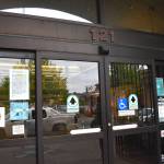 Matthew N. Wells / The Daily World
The glass sliding entry door to Aberdeen Timberland Library now has the new city code posted by the Aberdeen Code Enforcement. On Thursday, people with shopping carts, personal property and garbage were given 72 hours to clean up the area. The aim of the code is to keep the area in front of the library clear.