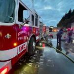 The Aberdeen Fire Department demonstrated spraying down a target at Badges and Brews, hosted at Starbucks on Sept. 22, 2022. (Michael S. Lockett / The Daily World File)