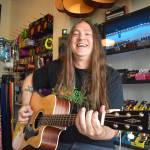 Matthew N. Wells / The Daily World
Ron Harless, co-owner of Guitar Galactica, shows how simple it is to play Nirvanas Come As You Are, on an acoustic guitar inside his and co-owner Joe Backus shop. Harless and Backus will be on hand Wednesday, June 21 to help people learn the classic Nirvana song. They will also help people sign up for a free raffle. The raffle prizes are an Alvarez RD26CE acoustic guitar, as well as an acoustic-electric ukulele.