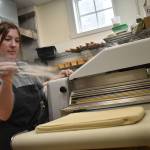 Grace Bryan prepares pastries at the Vista Bakeshop in Seabrook on Friday, June 16. The bakery recently expanded, adding a walk-up window and a dining and working area. (Clayton Franke / The Daily World)