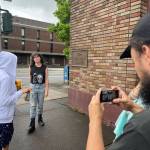 Matthew N. Wells / The Daily World
On Tuesday, Aria Taylor, left, stands with Mia Moore Marchant at the corner of South I and East Market streets in downtown Aberdeen. Taylor will play Tessa in Marchants film Again Again. Laffrey Witbrod, cinematographer for the sci-fi romance indie flick, uses an iPhone to see the shot composition. Co-director Heather Ballish looks at the shot composition. Witbrod said in film you dont just measure twice and cut once, you probably measure seven or eight times and cut once.