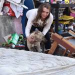 Matthew N. Wells / The Daily World
Jill and Scrawny Dew, a six-month-old puppy who was dropped off months ago with three other puppies and an offer of $20 to take them, stand near Jills home. Jill, who lives on three lots underneath Chehalis River Bridge, speaks about the trash people leave as donations. The city is trying to curb the issue with a proposed ordinance  still in discussion  from its Homelessness Response Committee.