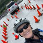 Officer Jamie Ancich of the Westport Police Department poses in front of a low-speed course during bike patrol training in Seattle. (Courtesy photo / WPD)