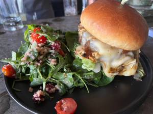Matthew N. Wells / The Daily World
A recent cheeseburger at Rediviva  118 E. Wishkah St., in Aberdeen. But its not just any cheeseburger. Its got seven ounces of 100% Wagyu beef. Its topped with carmelized onions, a dijon aioli and baby lettuce. The burger was served Wednesday night with mixed greens and was enjoyed immensely.