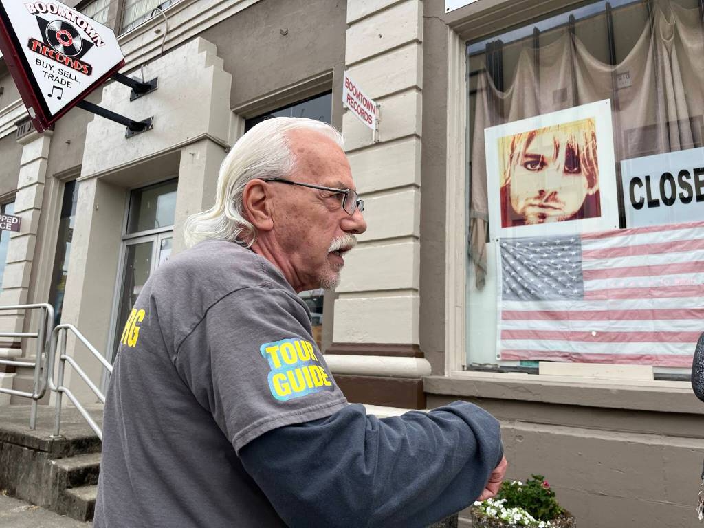 Matthew N. Wells / The Daily World
Phil Fill Slep begins the Nirvana Talk & Walk & Ride Tour at the front of Boomtown Records. Slep is a wealth of knowledge and knows how to lead a tour; it was informative and it kept people engaged. The next Nirvana-centered tour is 9 a.m. on Saturday, July 29, when Angel Phoenix Damasiewicz and Chris Svinth will kick it off with a short setlist.