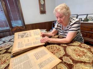 Michael S. Lockett / The Daily World
Pat Englund looks at clippings of The Daily World articles from the 70s, which tell the story of the early days of PAWS of Grays Harbor, now celebrating its 50th anniversary since incorporation.