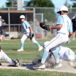 RYAN SPARKS | THE DAILY WORLD
Montesanos Tate Eaton, left, is tagged out at first during a District 3 8-10 championship game on Thursday at Lloyd Murrey Park in Elma.