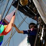 Michael S. Lockett / The Daily World
Paul Goza goes aloft to untangle a flag aboard the Lady Washington on July 2.