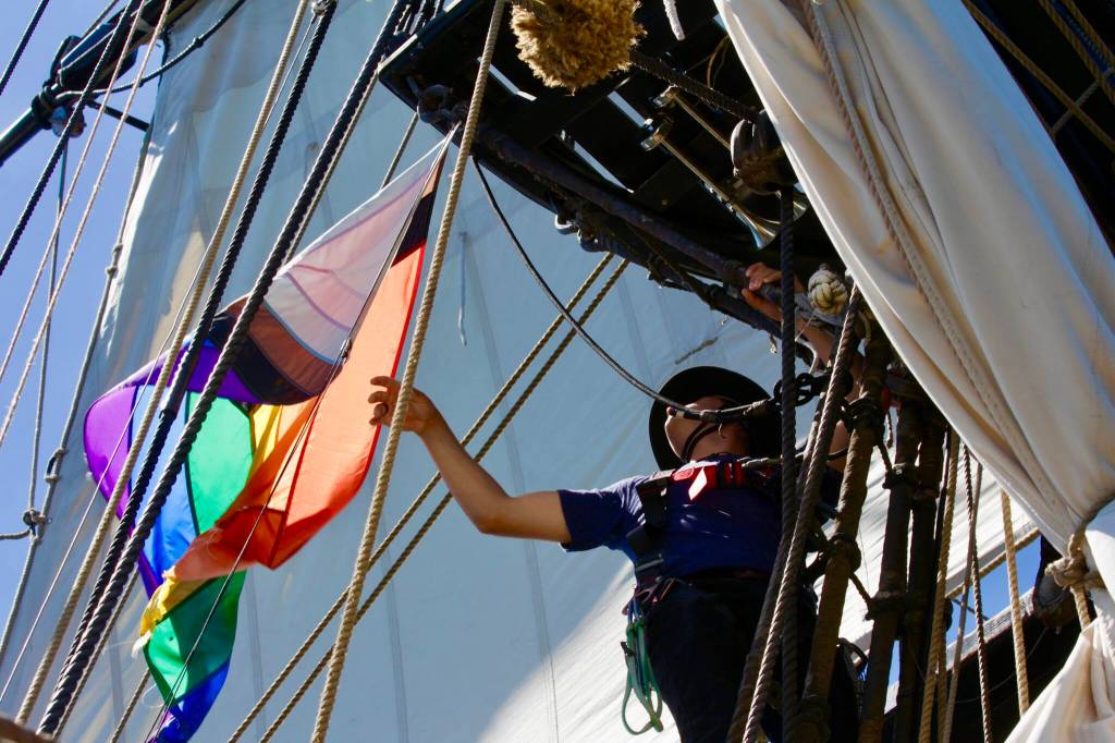 Michael S. Lockett / The Daily World
Paul Goza goes aloft to untangle a flag aboard the Lady Washington on July 2.