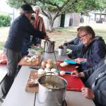 Donna Michalak, rear, heads an onion-chopping table Friday morning in preparation for the 64th annual McCleary Bear Festival. Volunteers chopped 150 pounds of onions for the stew. (Courtesy of Sue Michalak-Budsberg)