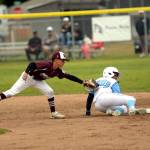 RYAN SPARKS | THE DAILY WORLD Montesano short stop Kale Kjesbu, left, attempts to tag out Larch Mountains Noah Tomaro during an 8-5 loss in the Little League District 3 Majors Tournament on Friday in Aberdeen.